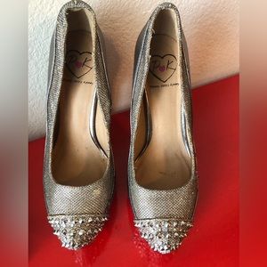 Metallic heels with spike detail.